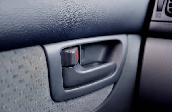 Closeup of modern car\'s inner door handle