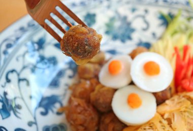 Luk Kapi or shrimp paste ball, one of the essential side dishes to have with Khao Chae, a signature Thai dish during summer