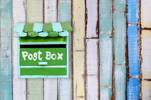 Green wooden mailbox with wooden background — Stock Photo, Image