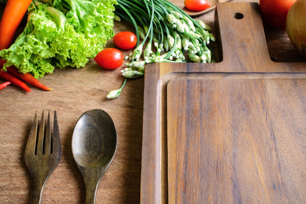 Fresh ingredients for cooking on wooden table background