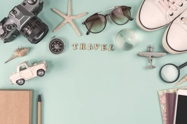 Outfit of traveler on green background with copy space