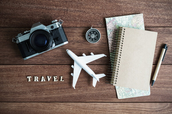 Traveler planning trip on wooden background and copy space, Travel concept