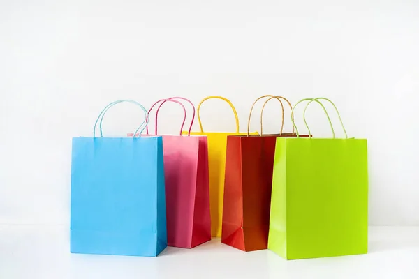 Colorful Paper Shopping Bags White Table Background Copy Space — Stock Photo, Image