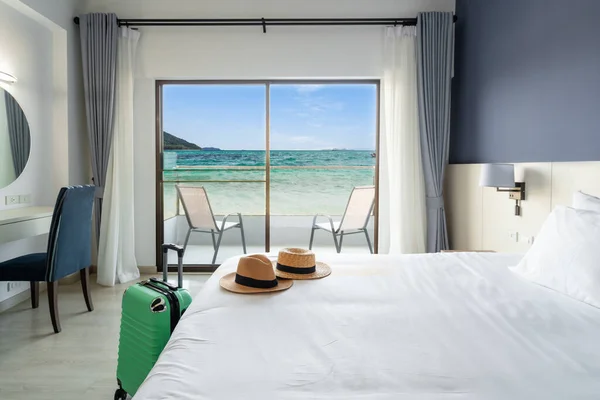 Luxury sea view hotel room with baggage, Travel concept