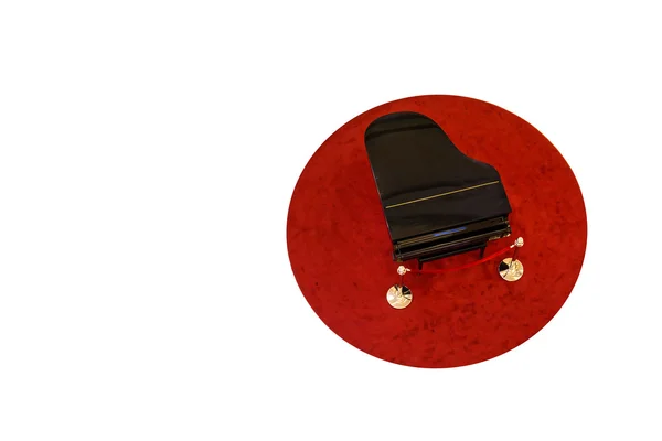 Piano sobre alfombra roja — Foto de Stock