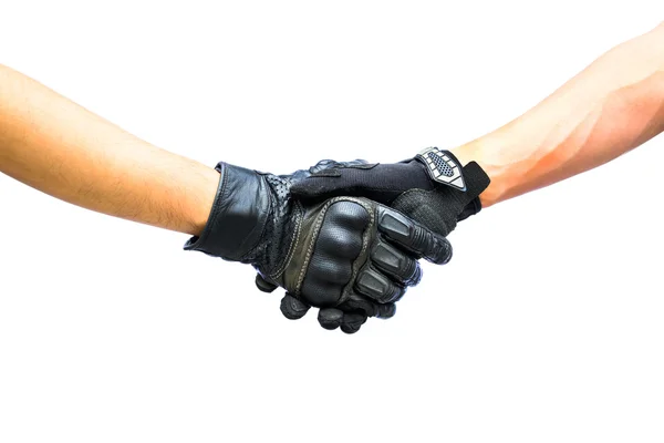Две руки байкерские перчатки встречаются в рукопожатие — стоковое фото