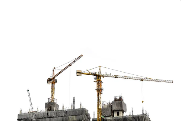 Construction cranes on white background — Stock Photo, Image