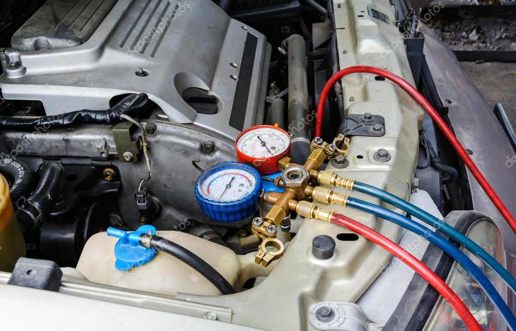 Filling air conditioning liquid — Stock Photo © Kitzcorner 61837969