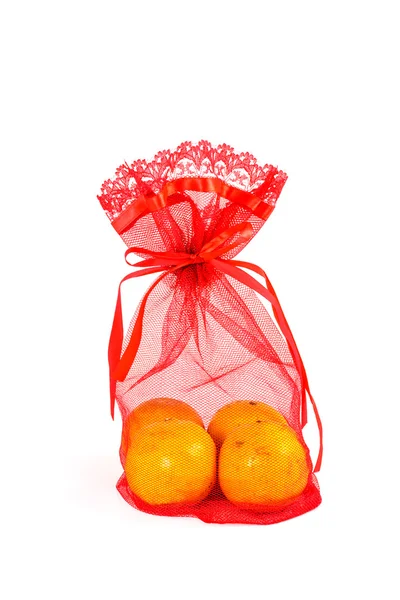 Mandarin orange and red net bag — Stock Photo, Image