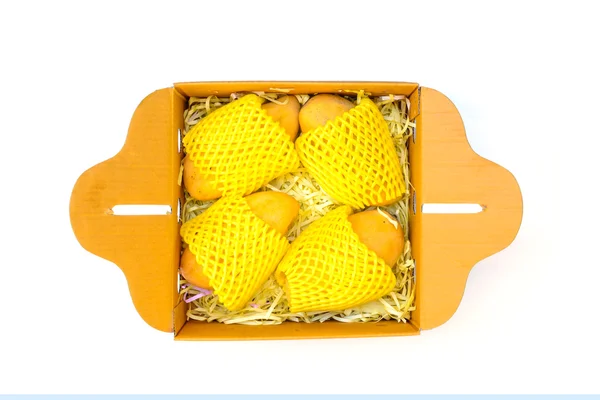 Ripped mangoes in a paper box — Stock Photo, Image