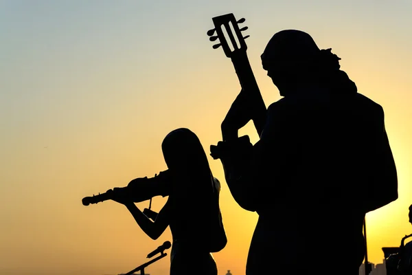 Silhouette of band playing the music — Stock Photo, Image