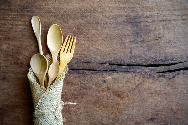 Set of wood spoon and fork on wooden table