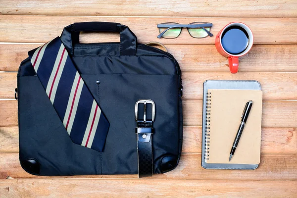 Cup of coffee and men accessories on wood — Stock Photo, Image