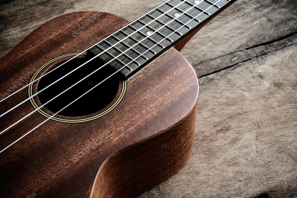 Close of ukulele old wooden background Stock Photo by ©Kitzcorner