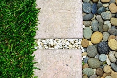 Ornament Stone footpath with pebble and grass