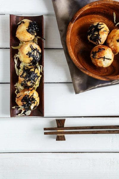 Takoyaki on wooden table with chopsticks, Japanese food — Stock Photo, Image
