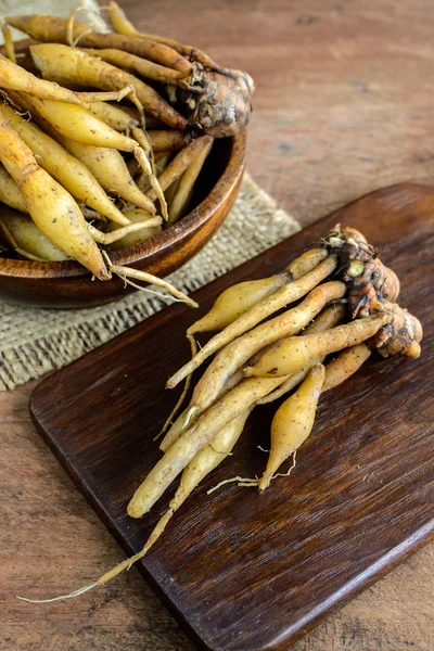 Fresh galingale (Boesenbergia rotunda) on wooden table — Stock Photo, Image