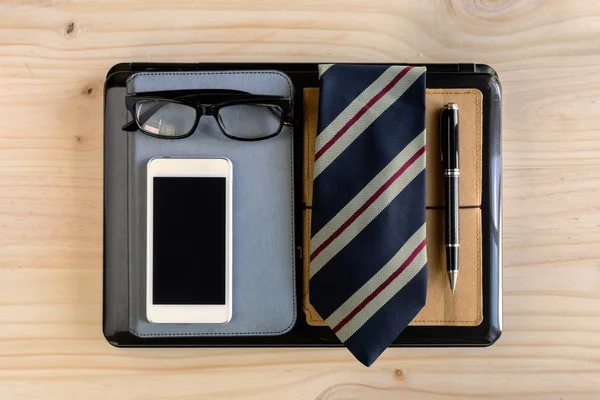 Businessman accessories and notebook bag on desk — Stock Photo, Image