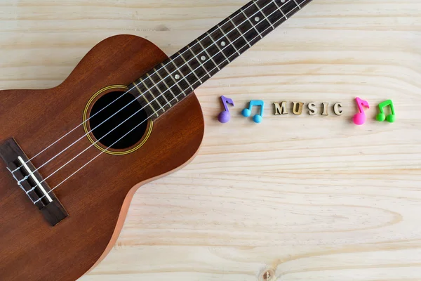 旧木制背景上的ukulele特写 — 图库照片