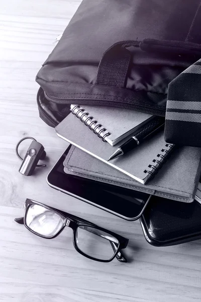 Businessman accessories and notebook bag on desk — Stock Photo, Image