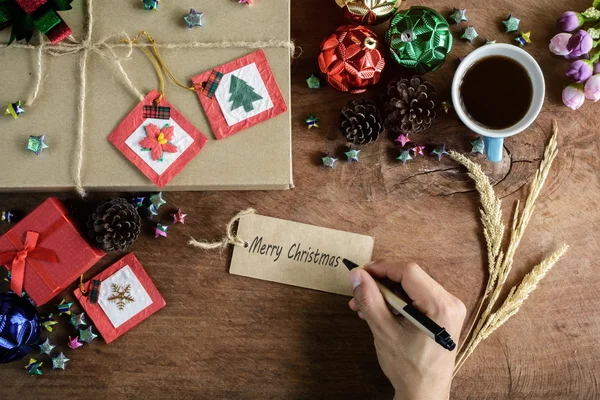 Brown gift box and coffee on old wooden background, Christmas co — Stock Photo, Image