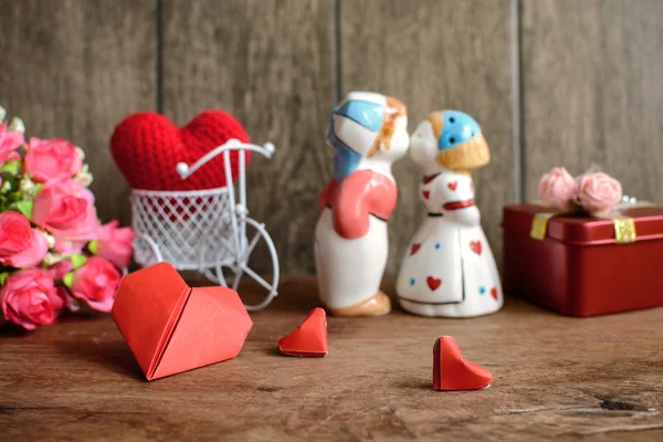 Lovely kissing couple on wooden background, Valentines day — Stock Photo, Image