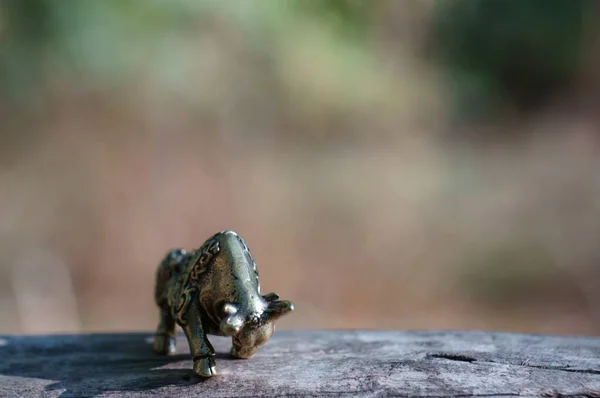 Metal bull figurine close-up. Symbol of the year 2021.