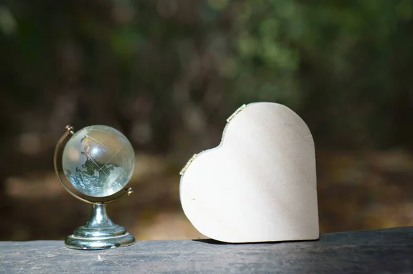 Small Glass Globe Wooden Heart Close — Fotografia de Stock