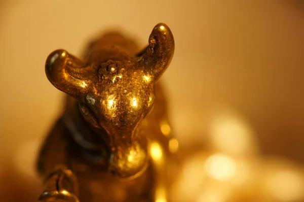 Metal bull figurine close-up. The symbol of 2021.