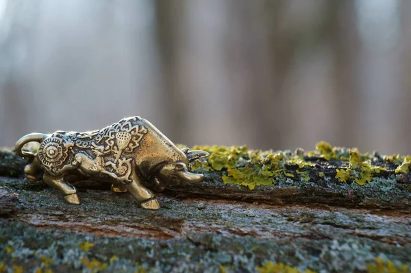 Metal bull figurine close-up. The symbol of 2021.