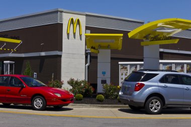 Indianapolis - Circa June 2016: McDonald's Restaurant Location. McDonald's is a Chain of Hamburger Restaurants V clipart