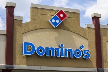 Muncie, IN - Circa August 2016: Domino's Pizza Carryout Restaurant. Domino's is 97% franchise-owned with 840 independent franchise owners I clipart