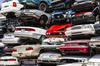 Indianapolis - Circa August 2016 - A Pile of Stacked Junk Cars - Discarded Junk Cars Piled Up V clipart