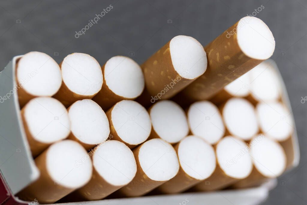 Cigarette close-up. Quitting smoking is the single easiest way to avoid heart disease.