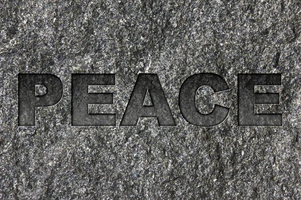 Peace Etched Bold Dark Gray Text Black Granite — Stock Photo, Image