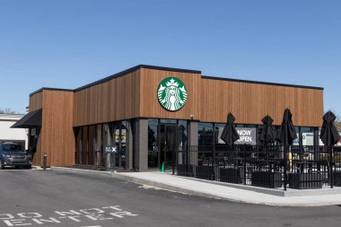 Indianapolis - Circa March 2021: Starbucks Retail Coffee Store. Each year, Starbucks celebrates Fall with Pumpkin Spice Lattes.