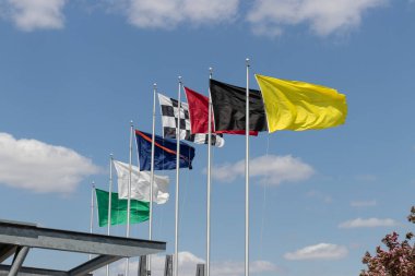 Indianapolis - Circa April 2021: The seven racing flags at Indianapolis Motor Speedway. IMS is preparing for the Indy 500 and Brickyard 400 in the age of Social Distancing. clipart
