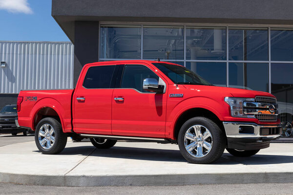 Plainfield - Circa April 2021: Ford F150 display at a dealership. The Ford F-150 is available in XL, XLT, Lariat, King Ranch, Platinum, and Limited models.