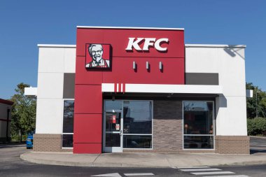 Cincinnati - Circa September 2021: KFC Chicken restaurant. Kentucky Fried Chicken is offering Uber and Door Dash delivery and drive thru service. clipart