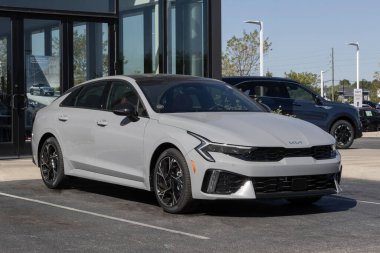 Avon - October 5, 2025: Kia K5 GT-Line Sedan display at a dealership. Kia offers the K5 with a 2.5L Direct injection 4-Cylinder engine. MY:2025