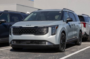 Avon - October 5, 2025: Kia Carnival Hybrid SX MPV display at a dealership. Kia offers the Carnival with a 1.6L Turbo Hybrid Powertrain. MY:2026