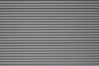 Binanın dış tarafındaki galvanize çelik paneller oyulmuş. Arkaplan, duvar kağıdı veya kırpma maskesi için.