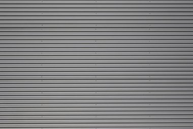 Binanın dış tarafındaki galvanize çelik paneller oyulmuş. Arkaplan, duvar kağıdı veya kırpma maskesi için.