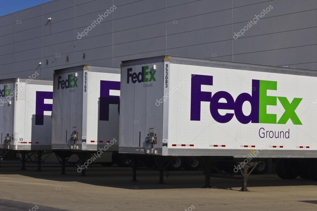 Indianapolis - Circa December 2015: Federal Express Trucks in Loading Docks. FedEx is a global courier delivery services company II