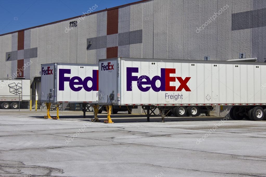 Indianapolis - Circa February 2016: Federal Express Trucks in Loading Docks. FedEx is a global courier delivery services company VII