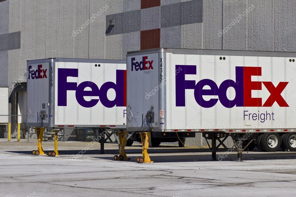 Indianapolis - Circa February 2016: Federal Express Trucks in Loading Docks. FedEx is a global courier delivery services company VI