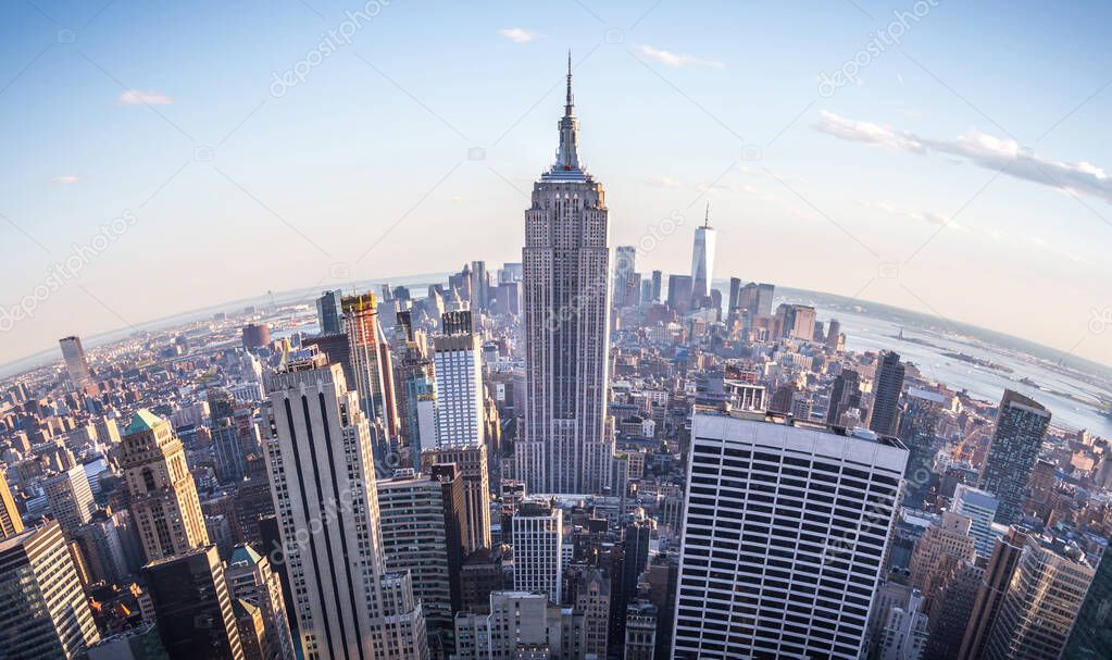 Fisheye aerial view of Manhattan in New York City, USA. Skyline panorama at sunset. Fish eye lens effect