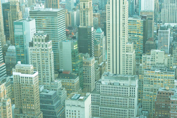 Faded aerial view of skyscrapers in New York City, Manhattan, USA. Green and blue toned