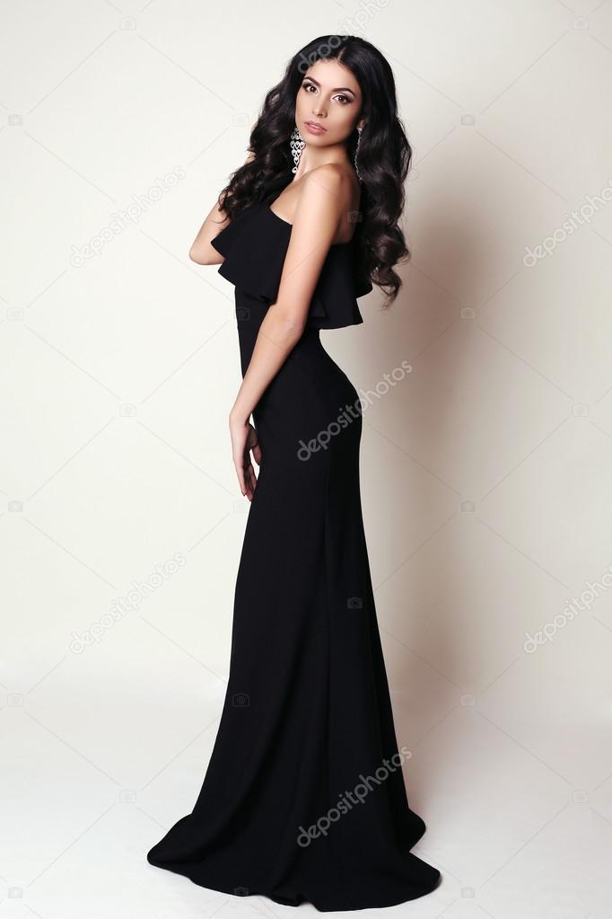 Beautiful woman in evening dress and diamond earrings Stock Photo by  ©Iniraswork 57762941