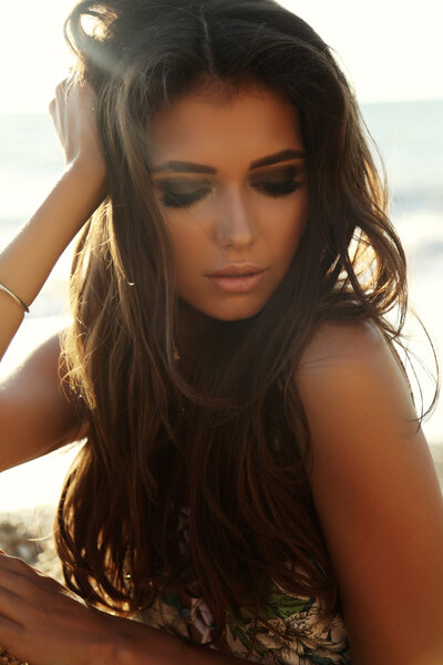 gorgeous sexy woman with dark hair in elegant dress  